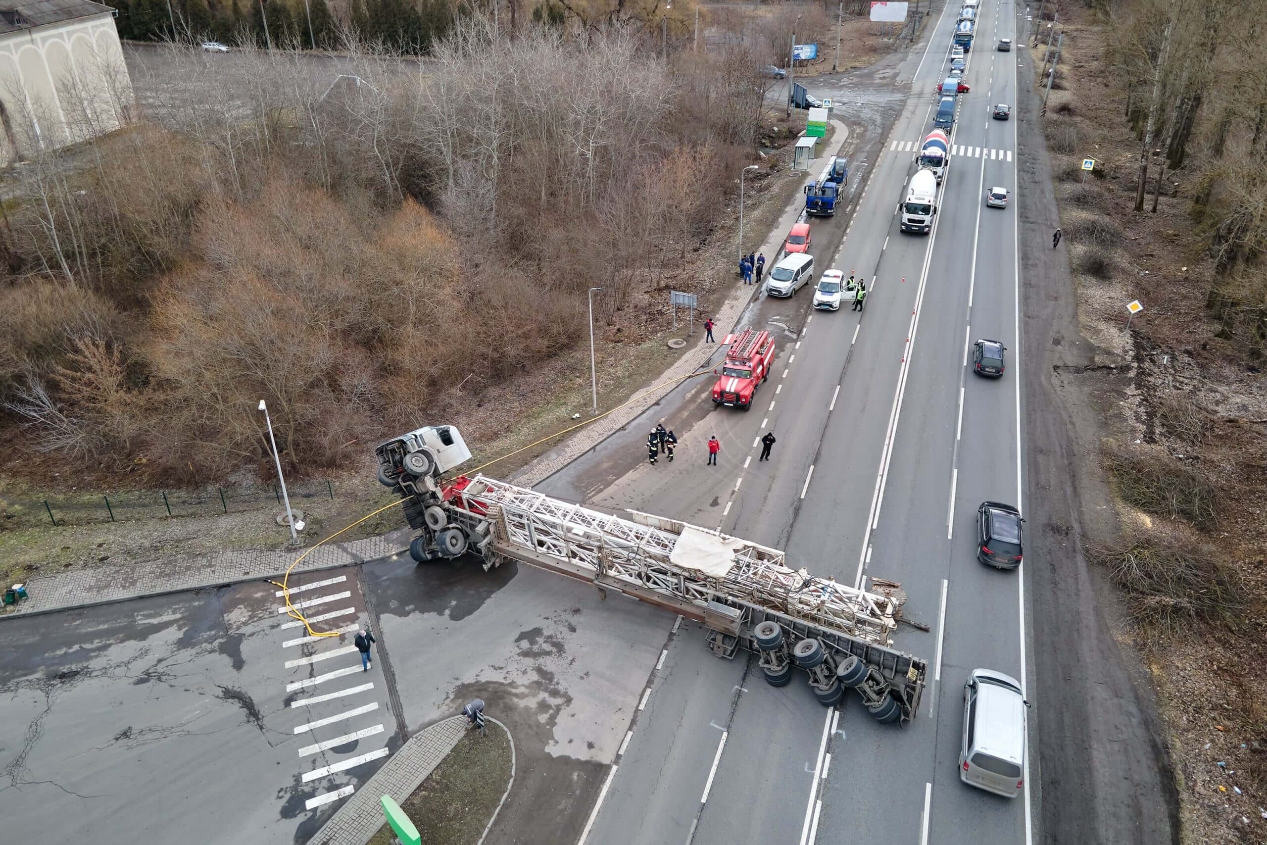 Truck accident on the freeway with a big rig on its side